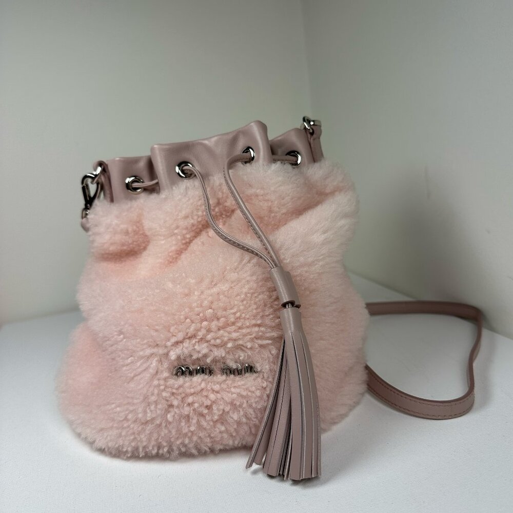 Miu Miu shearling bucket bag in Pastel Pink